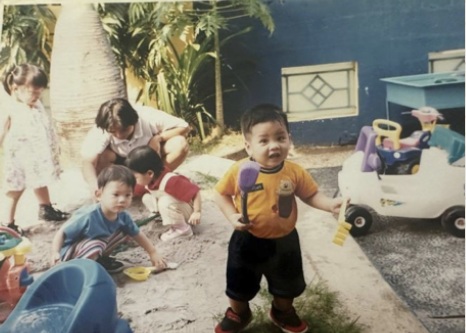 School archive: young children playing outdoors in the sand